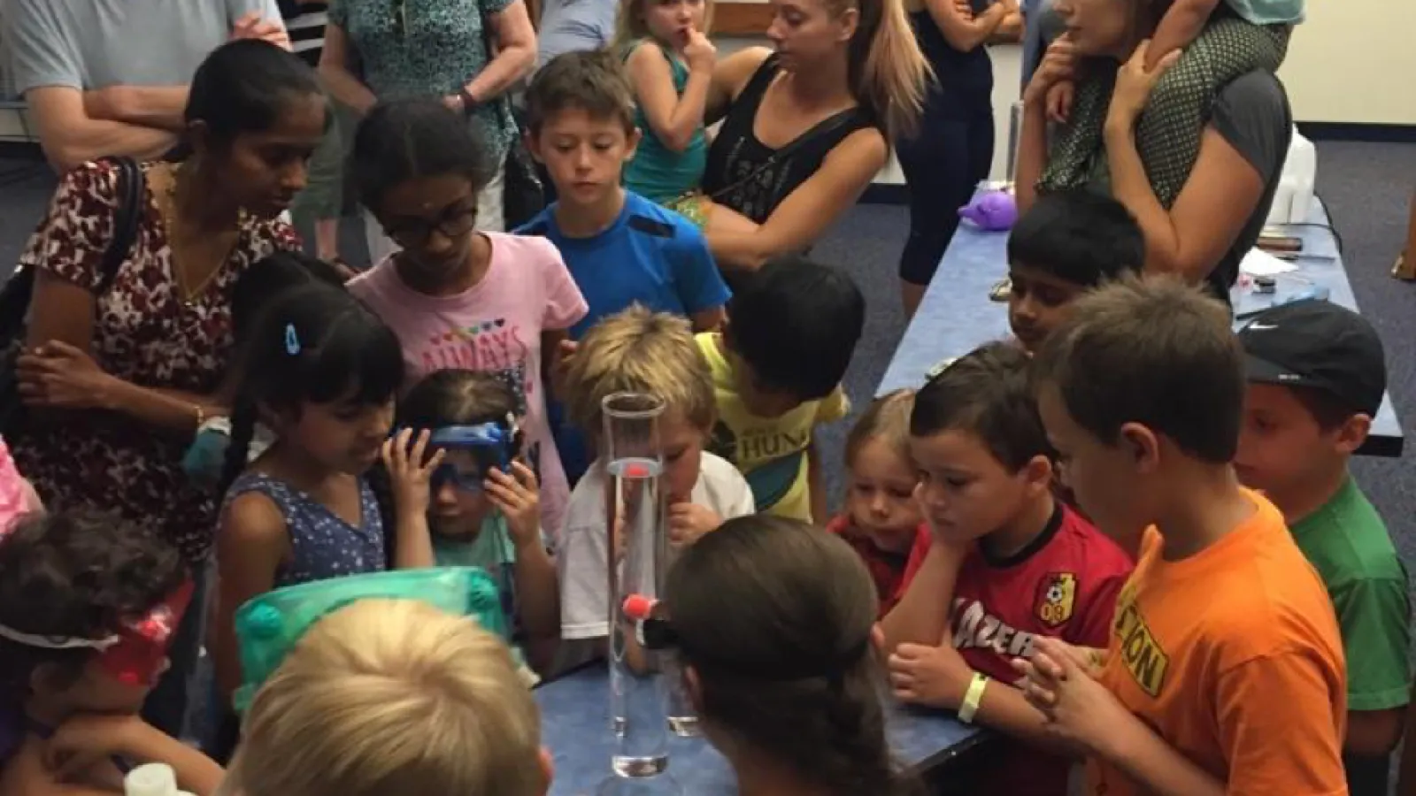 Children watching science demo